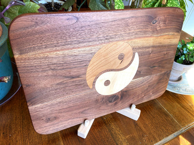 Walnut charcuterie board with Cherry and Maple Yin Yang wood inlay, handcrafted serving board