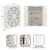 White carved wood wall cabinet with decorative floral pattern measuring 28x22x6.5 inches, shown closed and open with two shelves and labeled dimensions.