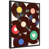 Framed canvas art featuring overlapping retro vinyl records with multicolored center labels in yellow, pink, red, cream, green, and blue on a cream background.