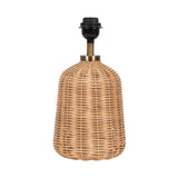 Table lamp base crafted from light tan woven rattan in a rounded, bell-like shape with a black and brass light socket fixture on top.