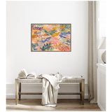 Abstract floral canvas by Amy Lighthall featuring layered pastel and earthy tones with overlapping leaf shapes in pink, orange, green, and blue, framed on a white wall above a wooden bench.