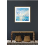 Framed painting of a serene coastal landscape with blue water and soft, cloudy sky hanging on dark gray wall above rustic wooden bench and woven baskets.