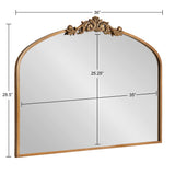 Traditional arch mirror with a gold frame and ornate carved crest centered at the top, measuring 36" wide by 28.5" tall with a 25.25" arch height.