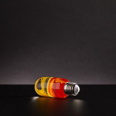 Three handcrafted resin LED bulbs with unique color patterns, shown in a 3-pack