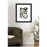 Black abstract looping brushstrokes on off-white background in a black frame, hung above an olive-green armchair and next to a woven basket with leafy green plant.