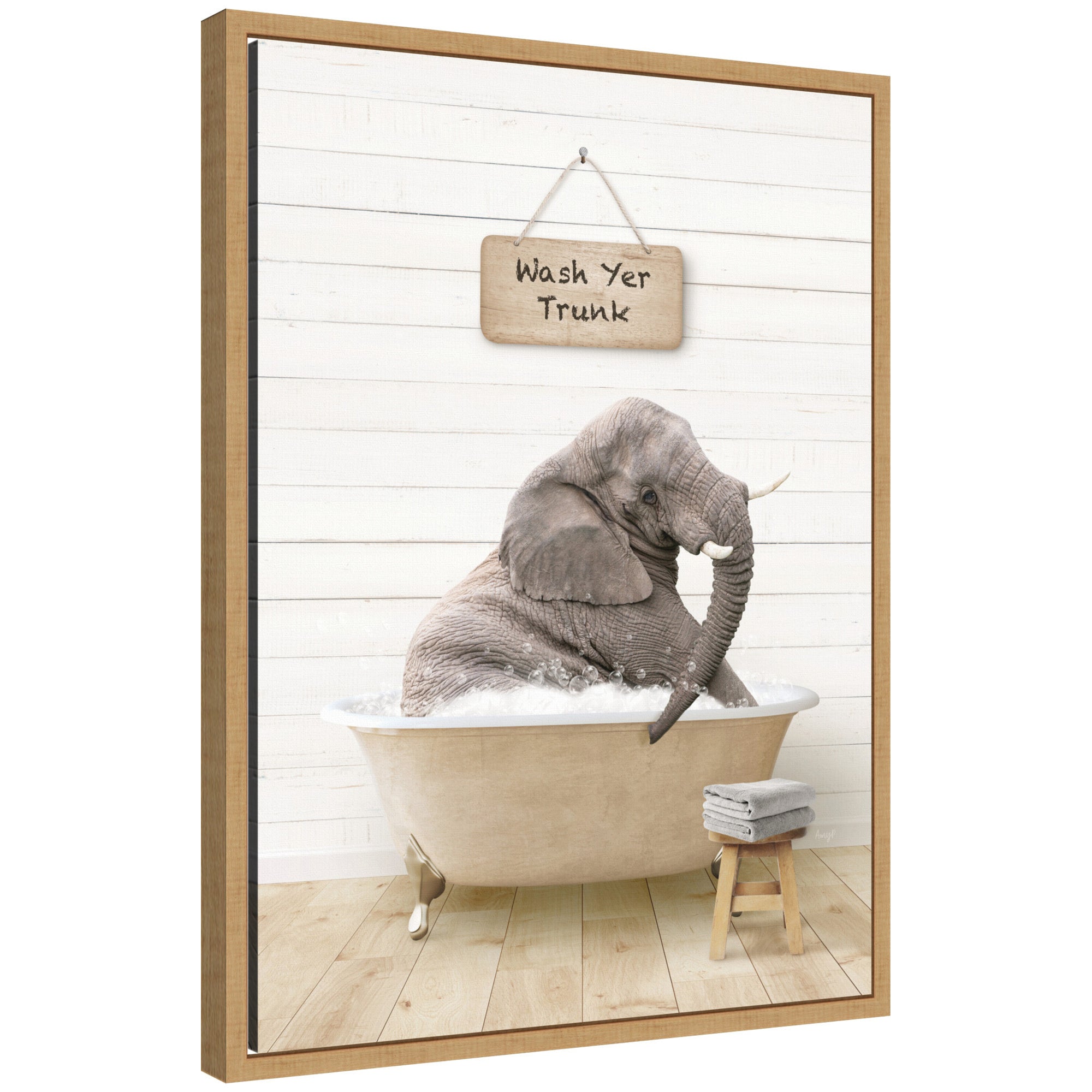 Framed canvas art of a young elephant sitting in a modern bathtub by Amy Peterson