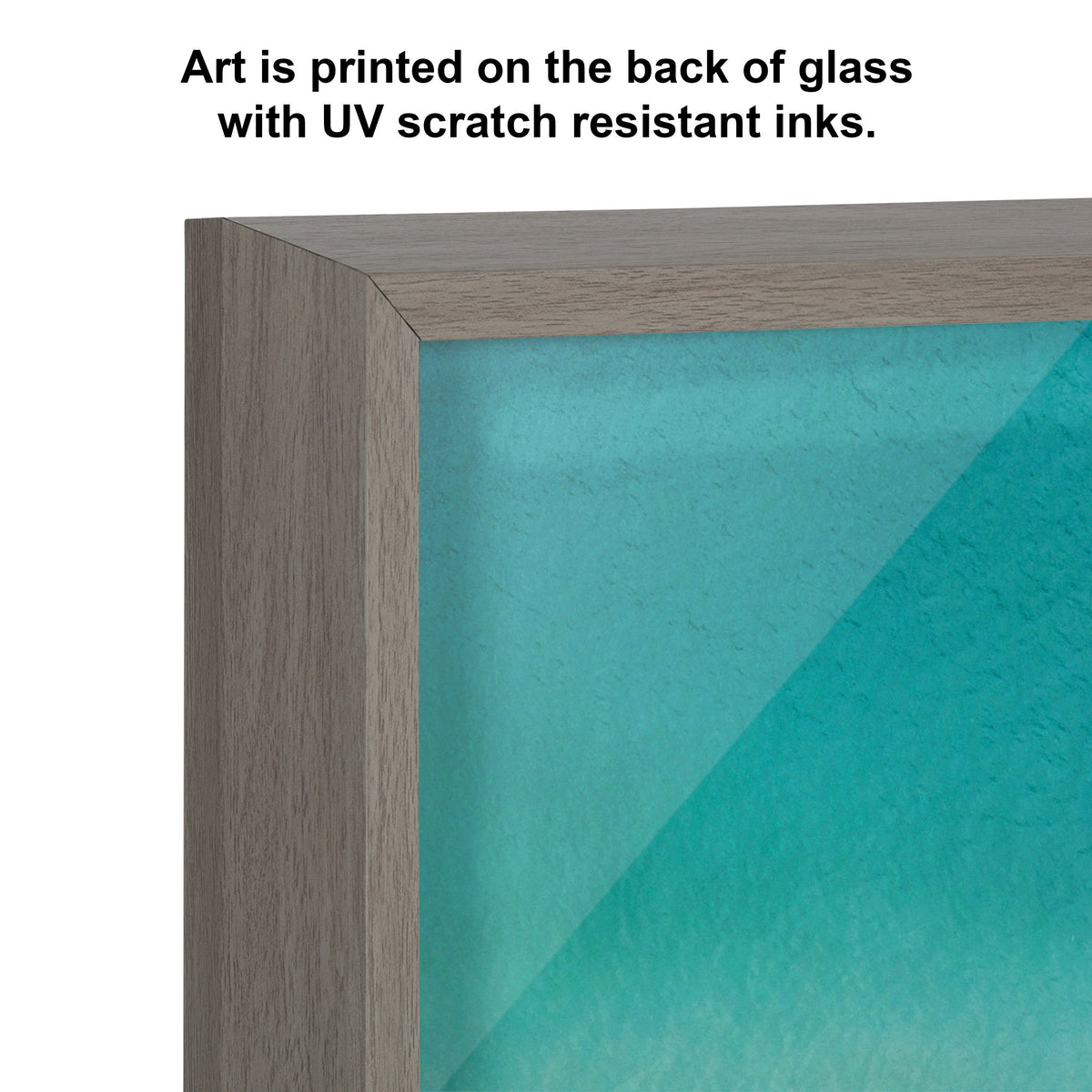 Close-up of a grayish wooden frame corner enclosing smooth glass printed with blue-green abstract art and text explaining UV scratch resistant inks on the back.