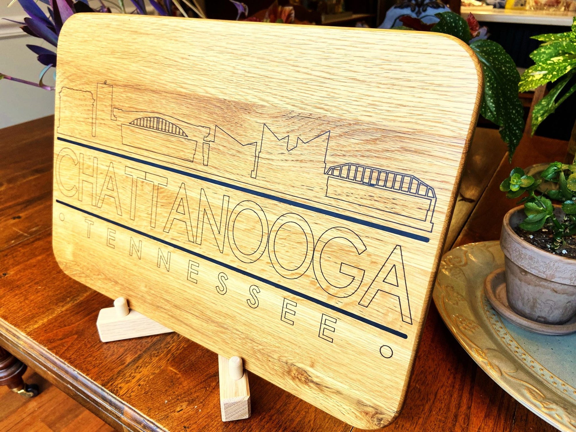 Handmade white oak charcuterie board with engraved Chattanooga skyline
