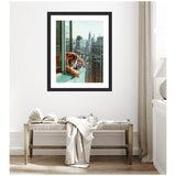 Framed art showing an orange tiger resting its head on a ledge while overlooking Manhattan skyscrapers, including the Chrysler Building, in daylight.