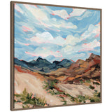 Nevada by Emily Kenney, a framed canvas wall art print depicting a rugged mountain landscape under a vibrant sky with dynamic clouds in Sylvie Walnut frame.