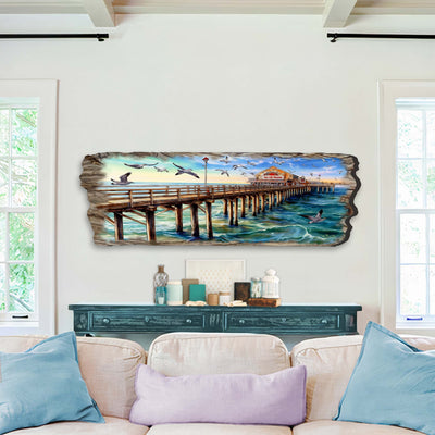 Pier Panorama Wooden Wall Art by G. DeBrekht depicting a coastal scene with a pier and seagulls