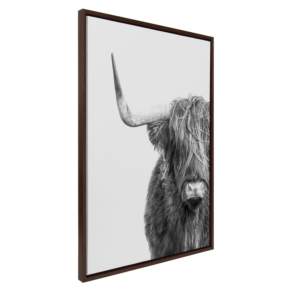 Framed canvas wall art showing a black-and-white portrait of a Highland cow