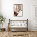 Abstract canvas wall art with overlapping translucent brown, beige, and gray circles above a wooden bench with white cushions in a minimal room.