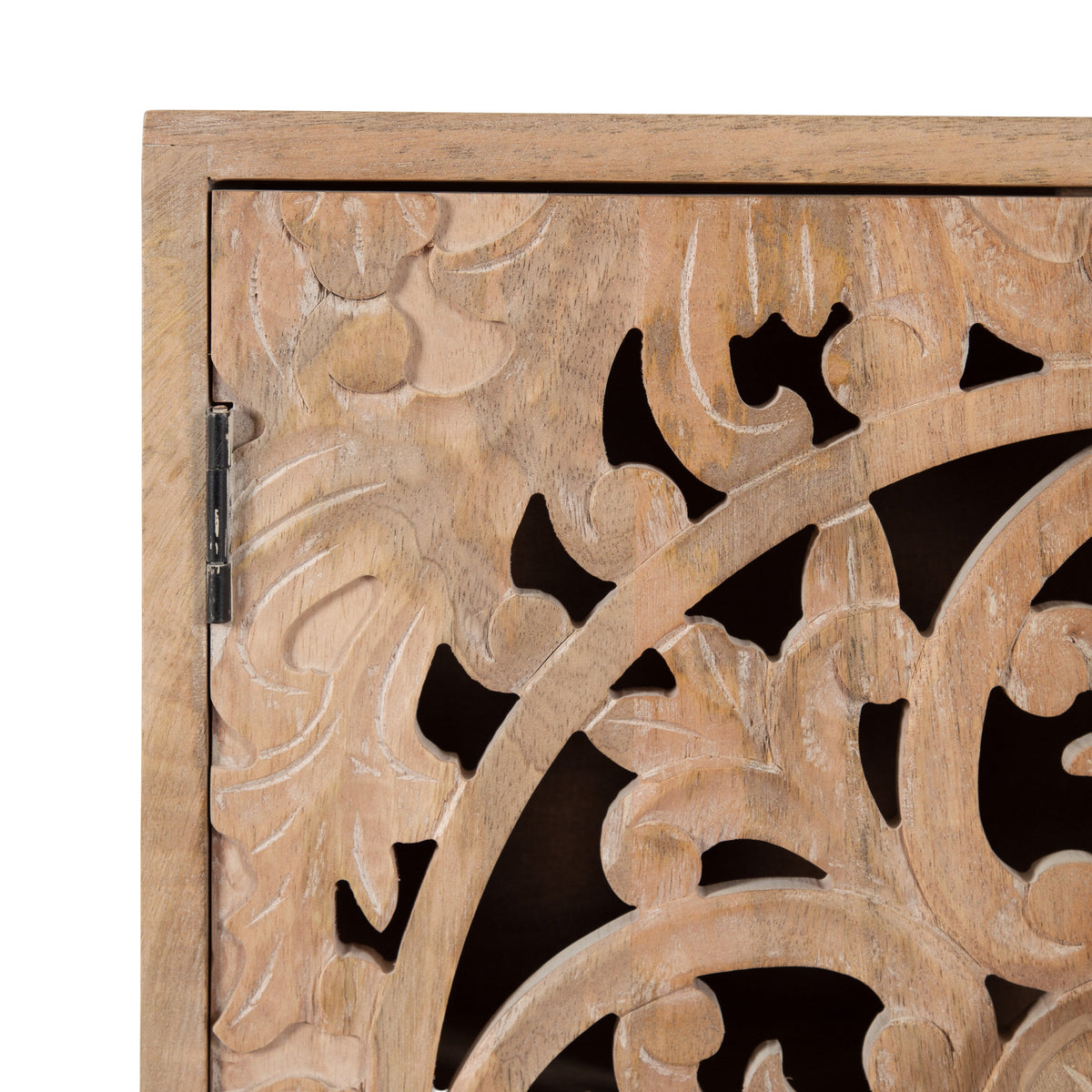 Light brown wooden cabinet door featuring intricate carved floral and curved patterns with open cutout details, showing a hinge on the left side.
