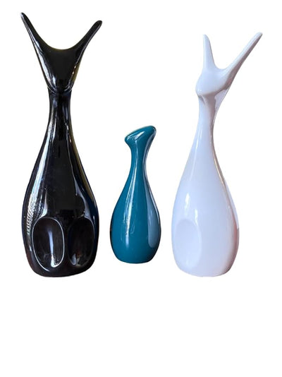 Matte finish ceramic Lucky Deer Family figures in black, white, and turquoise arranged on a neutral surface