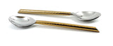 Set of six golden teaspoons with hammered handles laid out on a surface