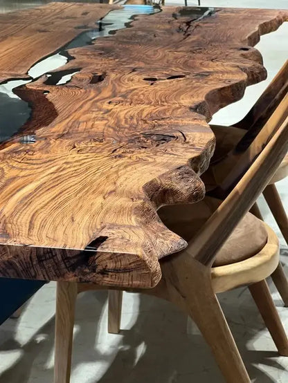 Live edge chestnut wood dining table with epoxy resin river and black legs