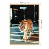 Tiger walking across a city street at night with white pedestrian lines and illuminated urban signs in the background.