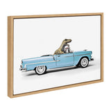Framed canvas showing a light blue 1958 convertible Chevrolet Corvette driven by a green toy dinosaur against a white background.