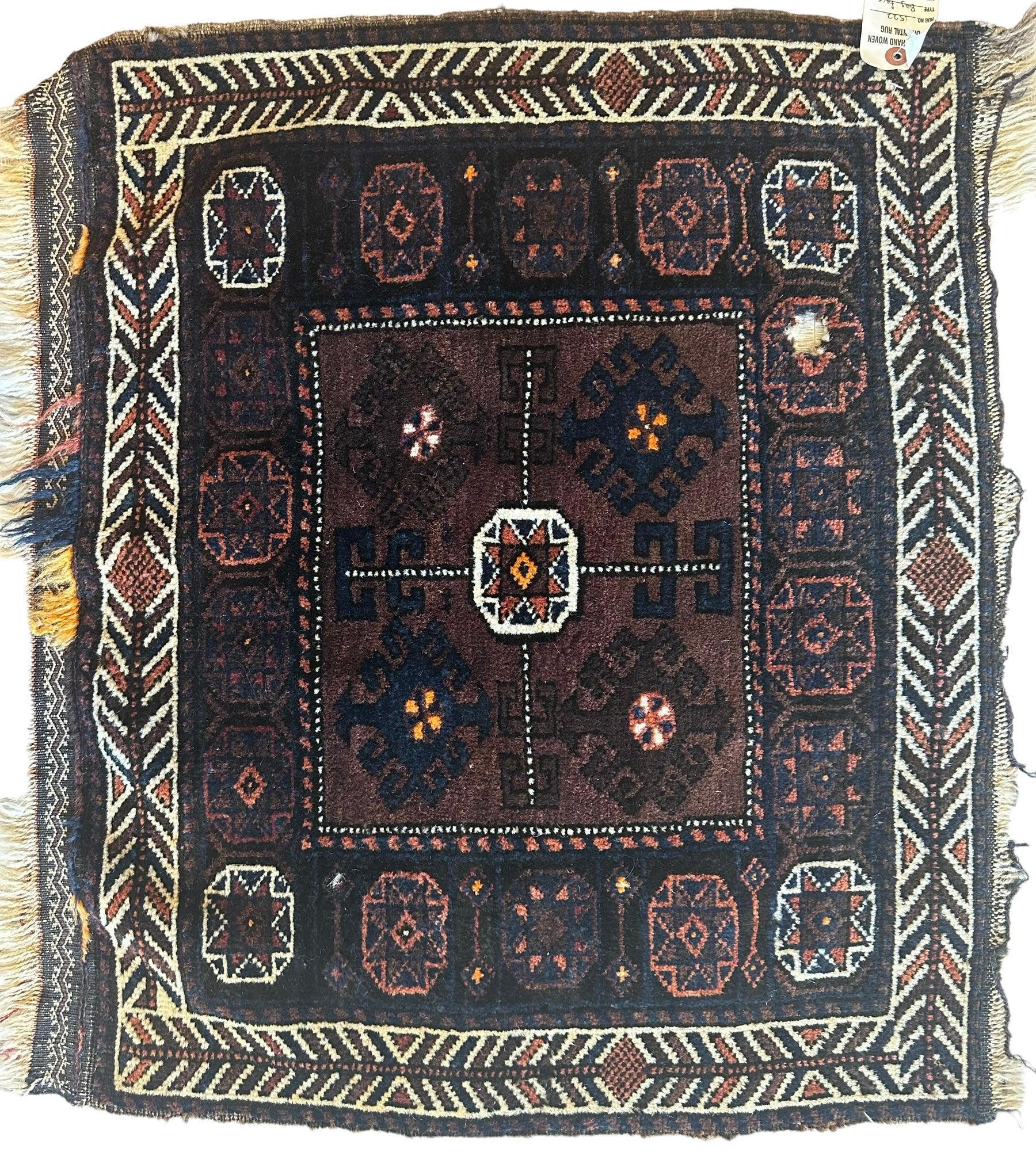 Distressed hand-knotted vintage Afghani Baluchi wool bag face rug, 29 x 25 inches