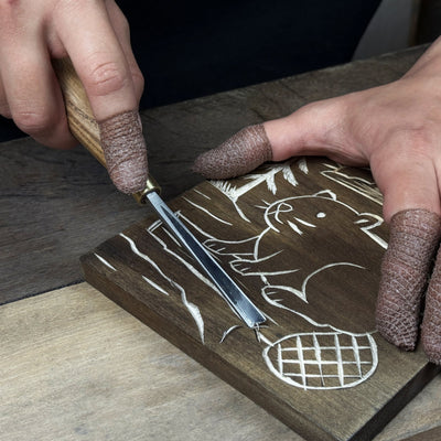 DIY Beaver Carving Kit with V-shaped chisel, pre-painted wood board, and video guide
