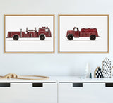 Two framed canvas prints of vintage red toy vehicles, a fire engine on the left and a water truck on the right, displayed side by side on a light wall above white storage units.
