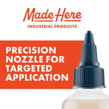 Close-up of a white plastic bottle with a dark blue precision nozzle cap against a white and orange background featuring the text 'Made Here Industrial Products' and 'Precision Nozzle for Targeted Application.'