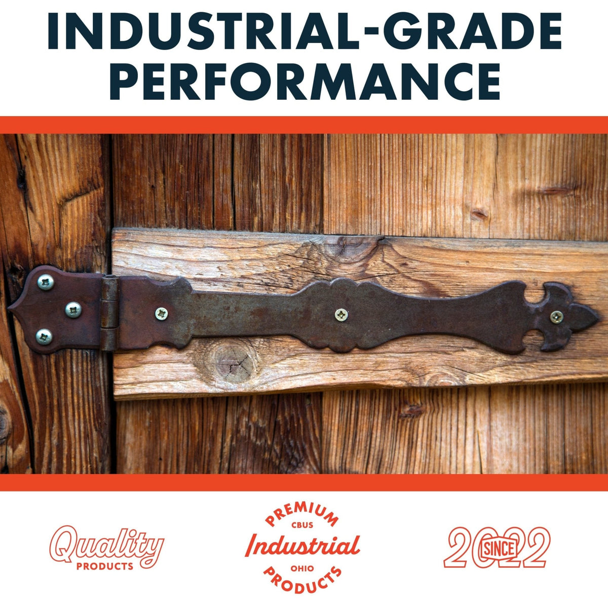 Close-up of a black decorative metal door hinge attached to rustic brown wood planks with visible screws and wood grain texture.