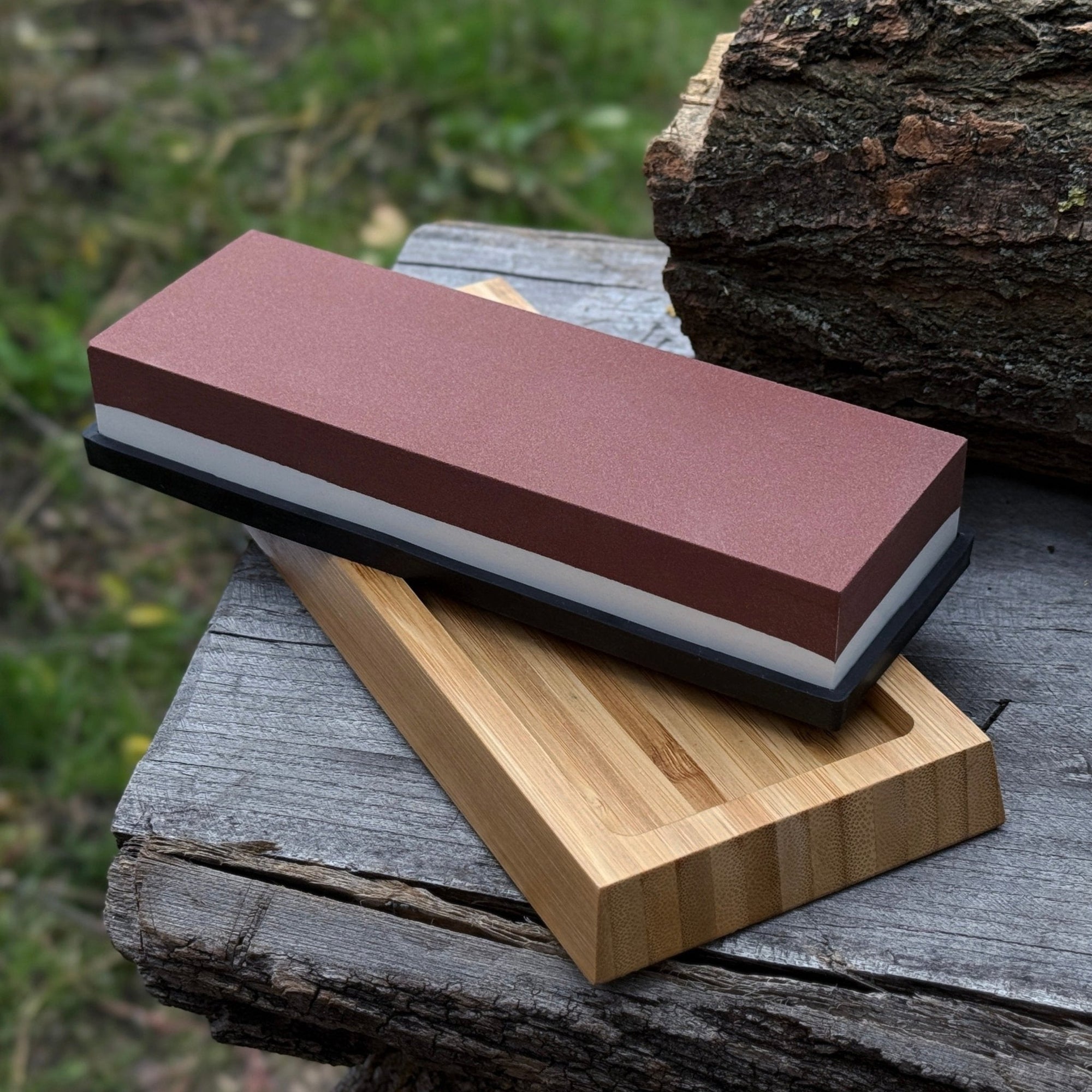 Double-sided sharpening stone with grit #3000 and #8000, shown with optional wooden stand