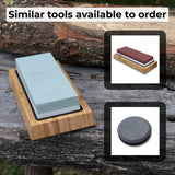 Double-sided sharpening stone with coarse #400 and medium #1000 grit, shown with optional wooden stand