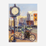 Impressionist style painting of a street clock on a pole with two bicycles parked nearby, buildings and cars in warm sunlight under a clear sky.