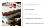 Close-up of several stacked canvases featuring colorful designs with elevated beaded float frames in various finishes, showcasing fine craftsmanship and layered textures.