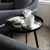 Resin Art Side Table with black metal frame and glossy resin-coated acacia wood tabletop in Northern Lights color