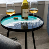 Resin Art Side Table with black metal frame and glossy resin-coated acacia wood tabletop in Northern Lights color