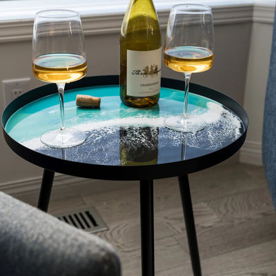 Resin Art Side Table with black metal frame and glossy resin-coated acacia wood tabletop in Northern Lights color