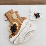 Snowman Resin Charcuterie Board with colorful resin design on acacia wood, displayed on kitchen counter
