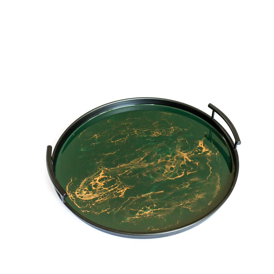 Round green resin tray with gold marbling and handles on a white background