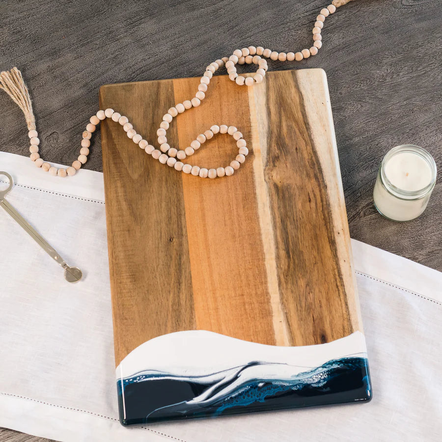 acacia resin serving bread board with resin design on a wooden surface
