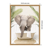 Front-facing elephant standing in a white clawfoot bathtub with bubbles, surrounded by green palm fronds against a white paneled wall, framed in light wood.