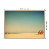Minimalist beach scene with a single wooden lifeguard hut on the sandy shore under a clear gradient blue sky, framed with 33 by 23-inch dimensions.
