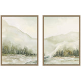 Two framed canvas paintings of soft, misty winter landscapes featuring faint mountains, pine trees, and muted green, beige, and white tones with a watercolor effect.