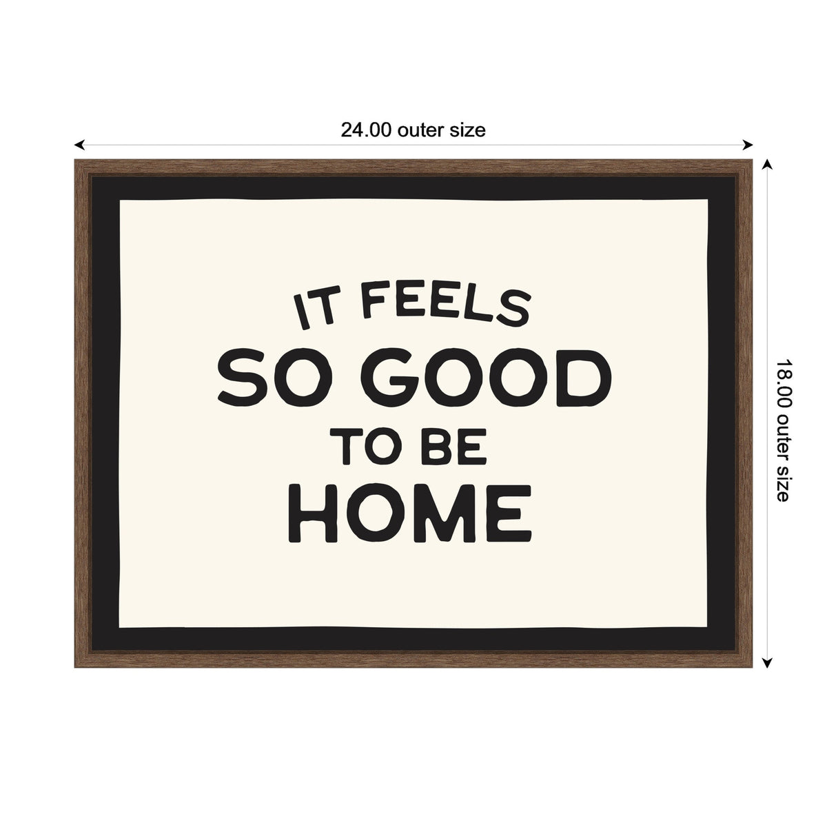 Framed canvas print with black text saying 'It feels so good to be home' on a white background, bordered by a black inner frame and a brown outer frame measuring 24 by 18 inches.