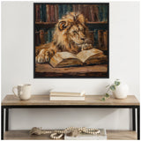 Painting of a lion resting its paw on an open book with shelves of books in the background, framed and hanging on a white wall above a wooden console table.