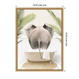 Rear view of a gray elephant standing in a cream-colored clawfoot bathtub surrounded by green palm leaves and white paneled walls, with a beige woven rug underneath.