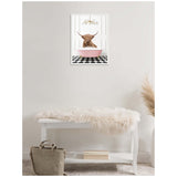 Framed canvas print of a Highland cow in a pink clawfoot bathtub on a black and white checkerboard floor, hanging above a white bench with a faux fur throw.