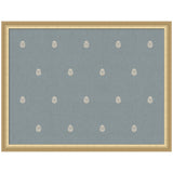 Rectangular blue fabric panel with a repeated small white botanical block print pattern, framed in a simple gold frame, shown front-on.