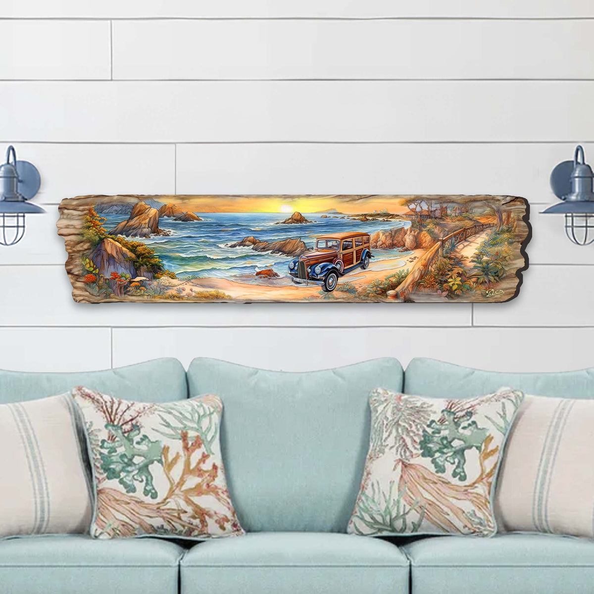 Long wooden wall art featuring a coastal scene with a retro woody car parked on a sandy beach surrounded by rocky cliffs under a glowing sunset sky.