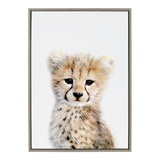 Framed canvas portrait of a cheetah cub with detailed fur and dark tear markings on a white background, looking slightly to the right side.