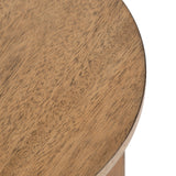 Close-up of a round wood tabletop with warm brown tones and natural grain patterns, showing smooth edges and a matte finish.