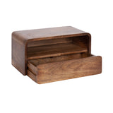 Rectangular wooden side table with rounded edges, featuring an open shelf above and a large drawer partially open at the front, showing wood grain texture.